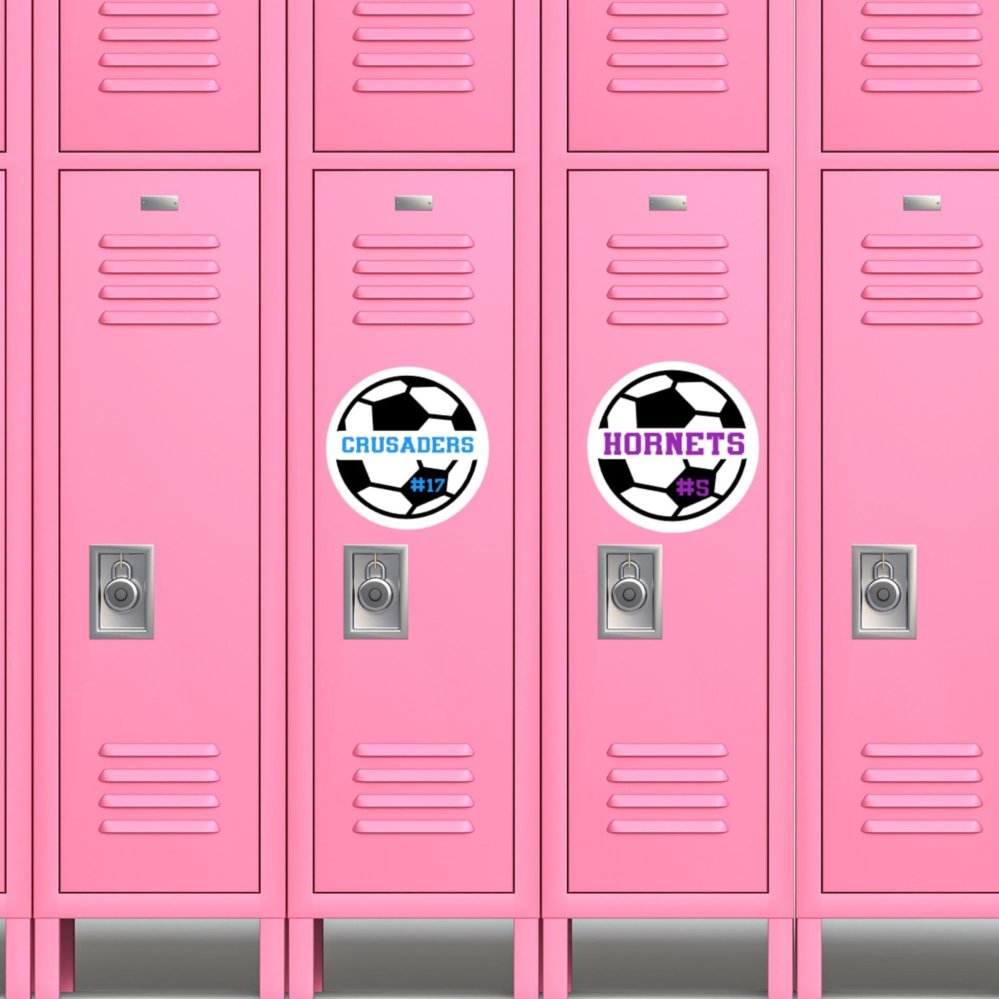 May include: Two pink locker doors with soccer-themed decals. The left locker has a white soccer ball with the words &#39;CRUSADERS #17&#39; in blue text. The right locker has a white soccer ball with the words &#39;HORNETS #5&#39; in purple text.